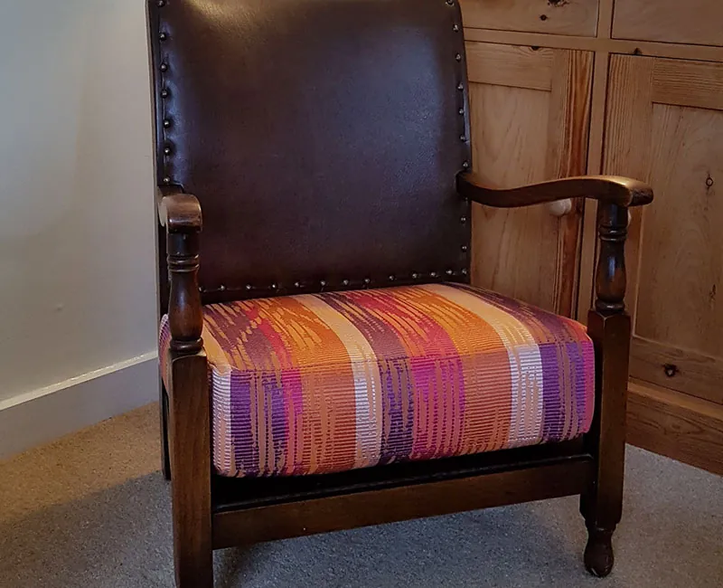 Re-upholstered armchair