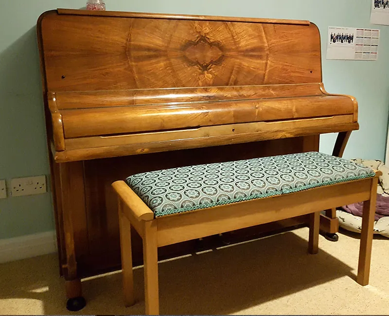 Re-upholstered piano stool